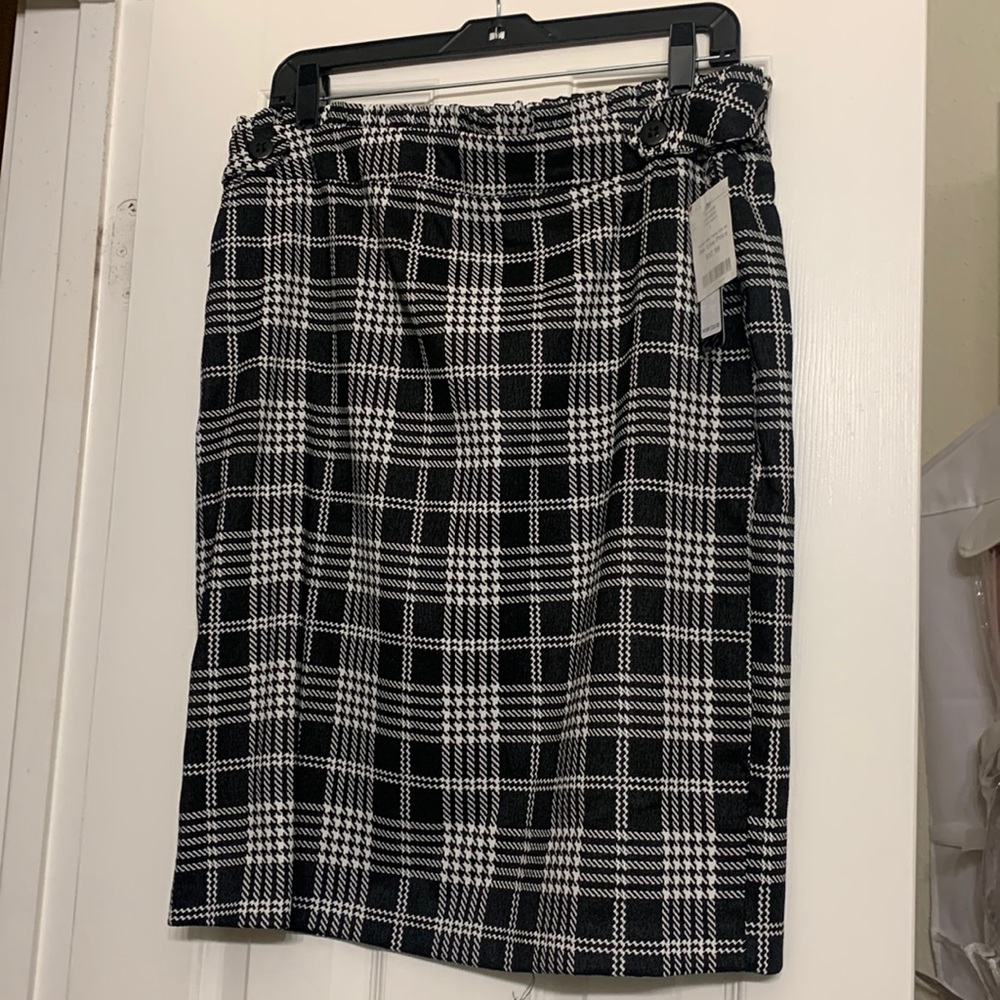 Black and white plaid, black buttons in the front, never worn with tags